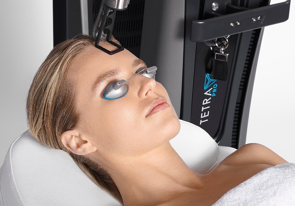 Woman receiving Tetra Pro treatment on forehead